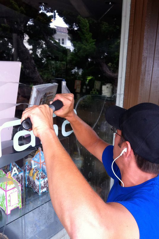 man cleaning window